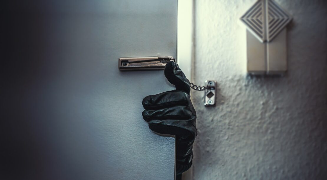 Burglar opening doors with a glove equipped